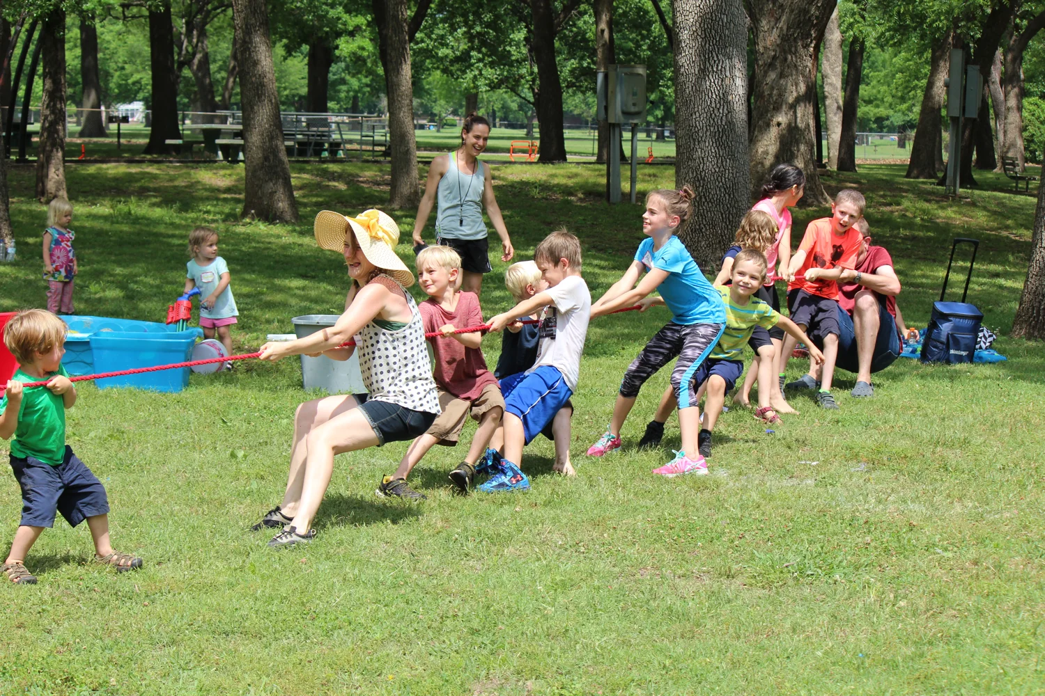 BCHEF children enjoying a tug-of-war game together at the park